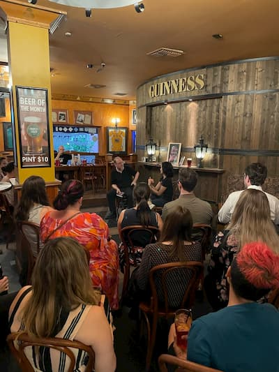 A crowd of booklovers at a cosy Irish pub, listening to a bookstore owner and a writer talk about Shakespeare in space.